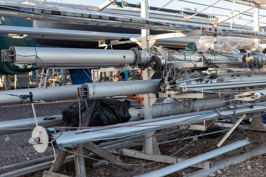 Espoo, Finland, March 23, 2025, Masts stored out of the boats for the winter, winter storage for the boat in Finland, Suomenoja, winterizing , short season in Northern country, cold conditions