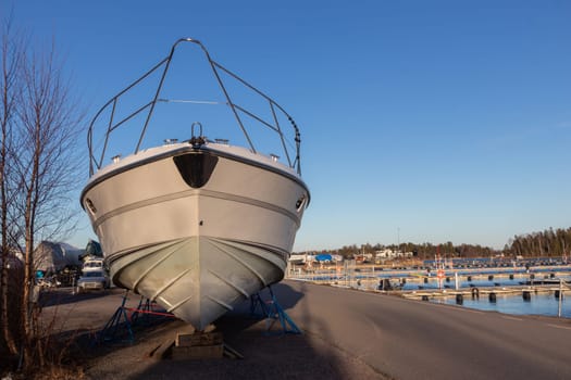 Boat stored out of the water for the winter, winter storage for the boat in Finland, Suomenoja, winterizing , short season in Northern country, cold conditions