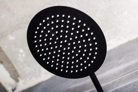 There is a black object that features a pattern of white dots all over its surface, making it quite distinctive and eyecatching