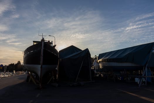 Sailboats stored out of the water for the winter, winter storage for the sailboat in Finland, Suomenoja, winterizing , short season in Northern country, cold conditions