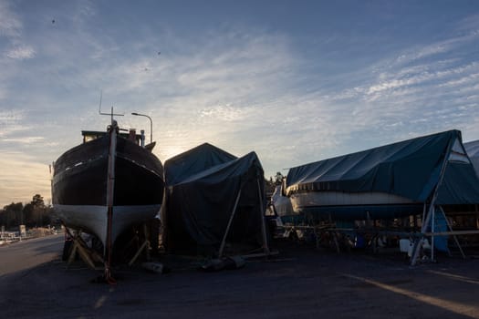 Sailboats stored out of the water for the winter, winter storage for the sailboat in Finland, Suomenoja, winterizing , short season in Northern country, cold conditions