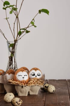 Funny owl family. Hand drawn owl Easter eggs, quail eggs and bird feathers. Space for your text.