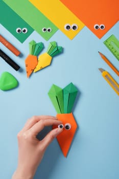 Making origami carrot. DIY project. Glue or draw eyes.