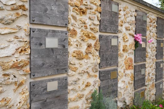Family columbarium for burial of urns with ashes or coffins European cemetery with graves