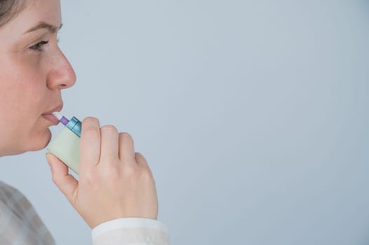 Caucasian woman smoking electronic cigarette. Tobacco heating system