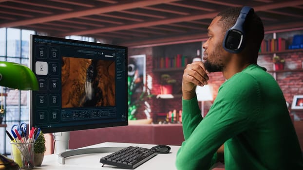 Digital editor uses AI powered text to video generator to create content, listening to music on headset. Internet connectivity and artificial intelligence tools on high tech software. Camera B.