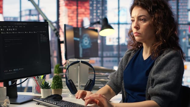Admin writing code and doing maintenance on artificial intelligence neural networks computerized model. Woman tech support expert doing checkup on AI systems, data science. Camera B.