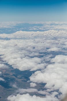 Landscape on the tops of the snow-capped mountains of the Caucasus from an airplane elluminator