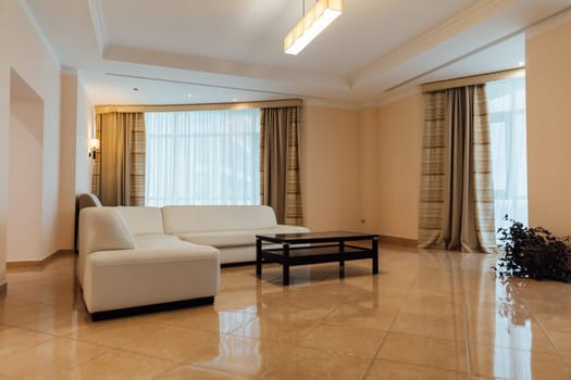Interior of a room with a sofa and windows