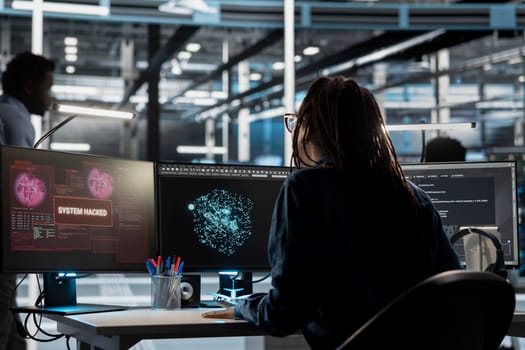 Data center engineer using AI visualization tool sees virus popup during security breach. Server farm worker using artificial intelligence analysis software interrupted by hacker attack stealing data