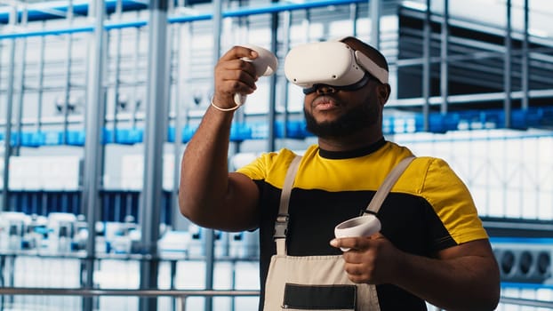 Smart factory engineer using VR headset to oversee operation of robotic arms and conveyor belts. Industry 4.0 plant technician monitors system performance using virtual reality, camera A