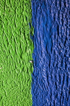 Two-color blue-green background. Rough plaster of two colors.