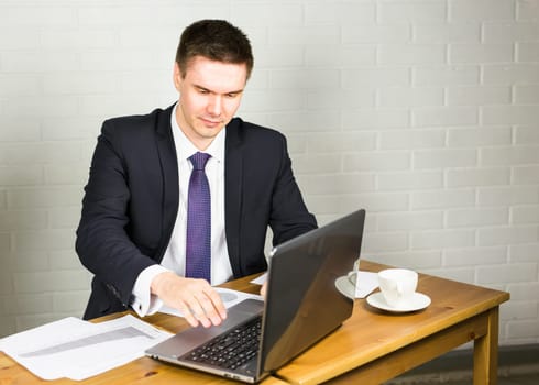 business man working with documents and laptop.