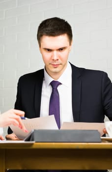 Business man working at office with documents on his desk, consultant lawyer concept.