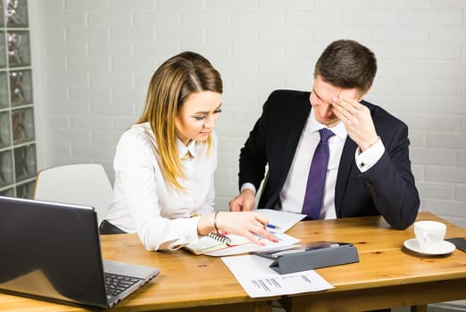 business couple working together on project at modern startup office