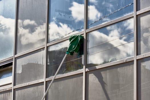 window washing, washing a street shop window. High quality photo