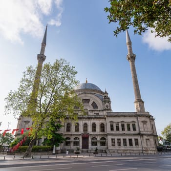 View from Meclis-i Mebusan Street overlooking Baroque style Dolmabahce Mosque, suited at the waterside of Kabatas, in Beyoglu district, Istanbul, Turkey