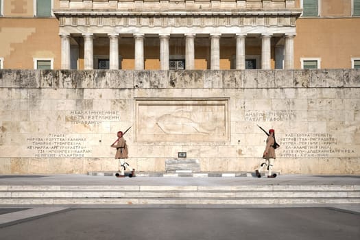 Ceremony of Presidential guard Evzones by the Greek tomb of Unknown Soldier. Evzones in summer uniform separate. Wide shot.