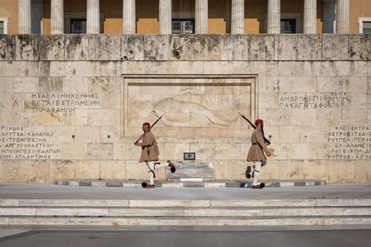 Ceremony of Presidential guard Evzones by the Greek tomb of Unknown Soldier. Evzones in summer uniform separate. Wide shot.