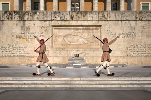 Ceremony of Presidential guard Evzones by the Greek tomb of Unknown Soldier. Evzones in summer uniform separate, march away Wide shot.