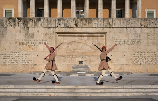 Ceremony of Presidential guard Evzones by the Greek tomb of Unknown Soldier. Evzones in summer uniform separate, march away Wide shot.