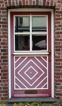 Old wooden house door in German small town, Wachtendonk, North-Rhine Westphalia
