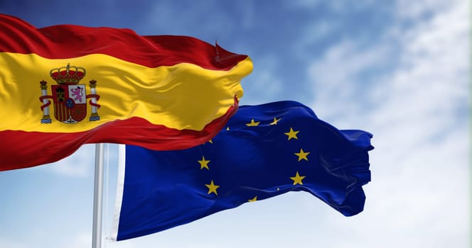 the flags of Spain and the European Union waving in the wind on a sunny day. Democracy and politics. European Union member state. 3d illustration render. Fluttering fabric