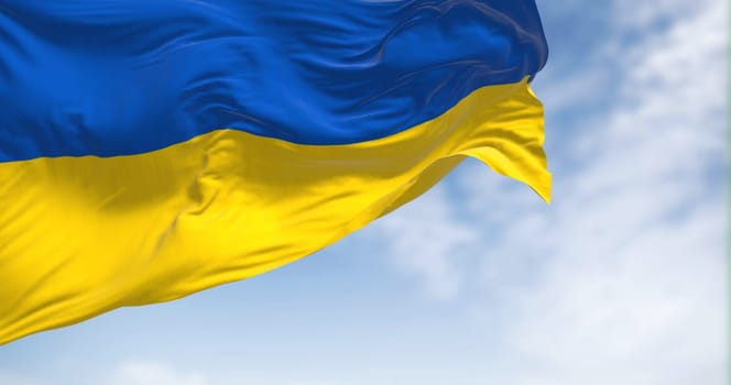 National flag of Ukraine waving in the wind on a clear day. Two equal horizontal bands of blue and yellow. Democracy and politics. 3d illustration render. Fluttering fabric