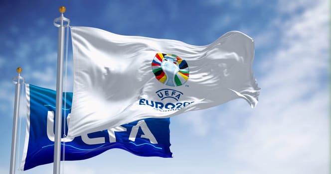 Berlin, DE, Feb 12 2023: Flags of Euro 2024 and UEFA fluttering in the wind. The 2024 UEFA European Football Championship will be hosted by Germany. Illustrative editorial 3d illustration render