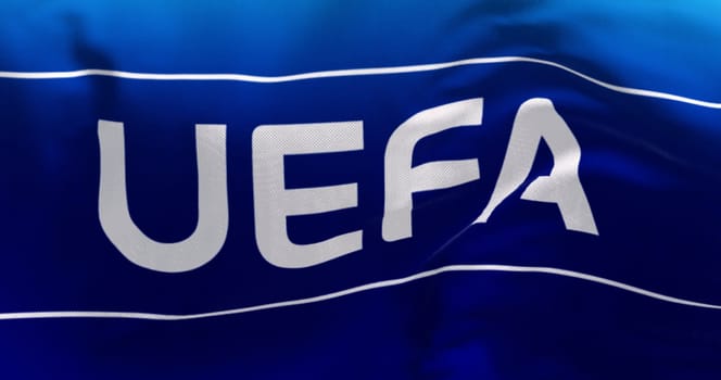 Nyon, CH, April 2023: Close-up of UEFA flag waving in the wind. UEFA is the association that manages professional football in Europe. Illustrative editorial 3d illustration render