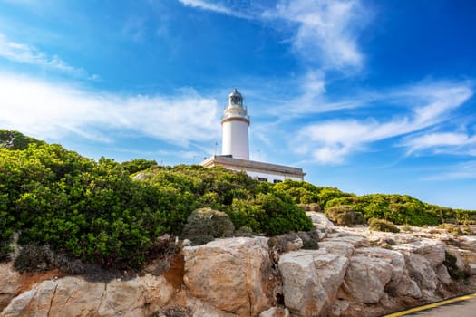 The beautiful lighthouse on the cliff of Cap Formentor. Balearic Islands Mallorca Spain. Vacation concept. One of the most visited landmark in Mallorca