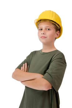 Three quarter torso view of a young Caucasian teenager wearing a yellow construction helmet, green t-shirt and crossed arms smiling proudly at the camera against white background.