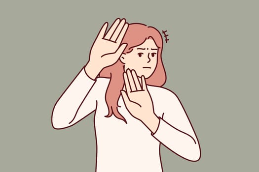 Brave woman makes gesture refusal, calls not to approach or stop discriminatory actions. Determined girl with dissatisfied emotions stretches palms to camera to fight against discriminatory behavior