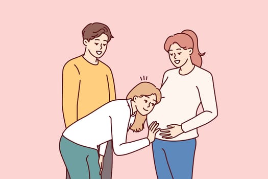 Pregnant woman stands with friends and allows to put ear to stomach to hear movements of baby. Pregnant girl rejoices that she will soon become mother and share positive with sister