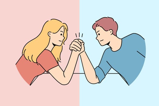 Arm wrestling between couple of man and woman for concept of fighting for leadership in family. Guy with girl compete who is stronger competing for position in company or leadership in team