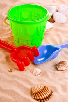 Children's toys -  bucket, spade and shovel on sand