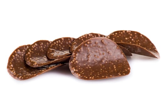 Chocolate chips isolated over white background