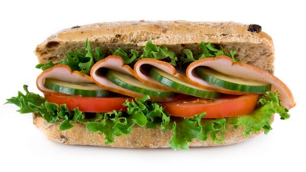 Freshly made ham and vegetable sandwich - isolated