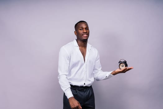 Happy african american young businessman in a formal suit portrait. Confident black guy posing