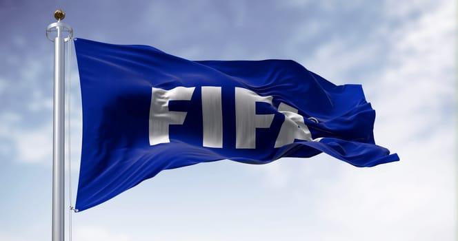 Zurich, CH, June 17 2023: Fifa flag waving in the wind on a clear day. International governing body of association football, beach football and futsal. Illustrative editorial 3D illustration render