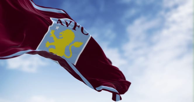 Birmingham, UK, Feb 24 2023: Aston Villa Football Club flag waving. English Premier League team. Fluttering fabric. Illustrative editorial 3d illustration render.