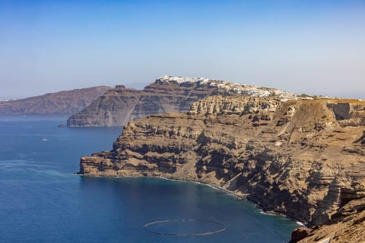 Magnificent view of the majestic volcanic cliffs of Santorini Island, Greece.