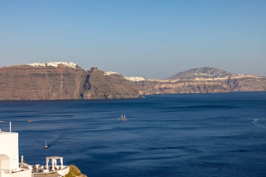 Panoramic view of the Santorini caldera cliffs from Oia village on Santorini island, Greece