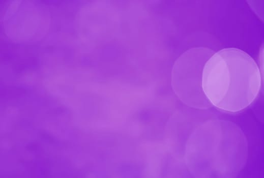 Light abstract purple bokeh christmas circle color glitter blurred black background