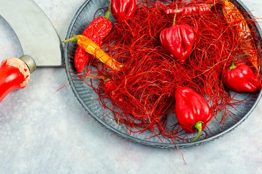 Spicy seasoning, spice, cut from red pepper. Thinly sliced pepper.