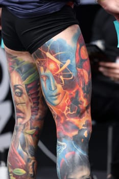 Krakow, Poland - June 12, 2022: Unidentified participant during the contest for the best tattoo at the 15th Tattoofest Convention in Cracow. One of the most prestigious tattoo festivals.