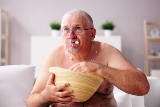 Sitting Overeating Food Lifestyle. Overweight People Watching Television