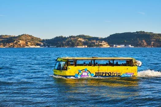 Lisbon, Portugal - August 31, 2022: HIPPOtrip amphibious sightseeing tourist bus in Tagus river