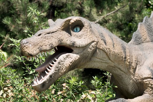 Animal portrait of dangerous extinct carnivore dinosaur on green background.