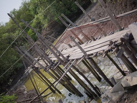 a small dam on the edge of the village and this small dam serves to irrigate crab pond fields in THAILAND . CONCEPT TRAVEL